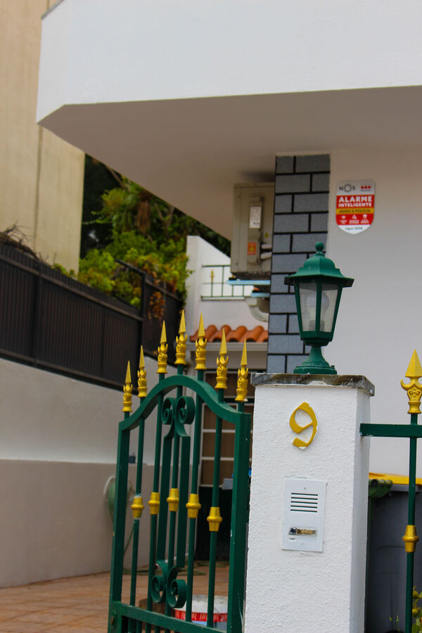 Finished home entrance with gate and pillar